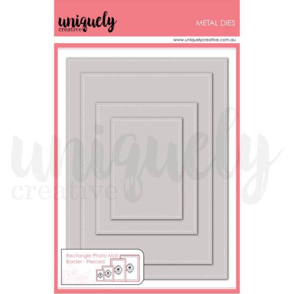 Rectangle pierced photo mat metal die set with four nested dies featuring dotted border detail for scrapbooking layouts.