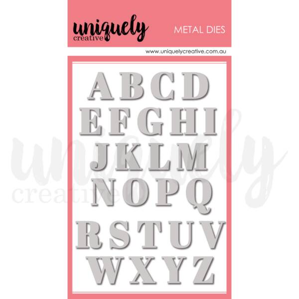 Serif uppercase alphabet metal die set with 26 letters A to Z in a classic font style with small decorative edges, shown on Uniquely Creative pink and white branded packaging